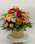 Medium Hat Box of Mixed Seasonal Flowers Bright Coloured Flowers