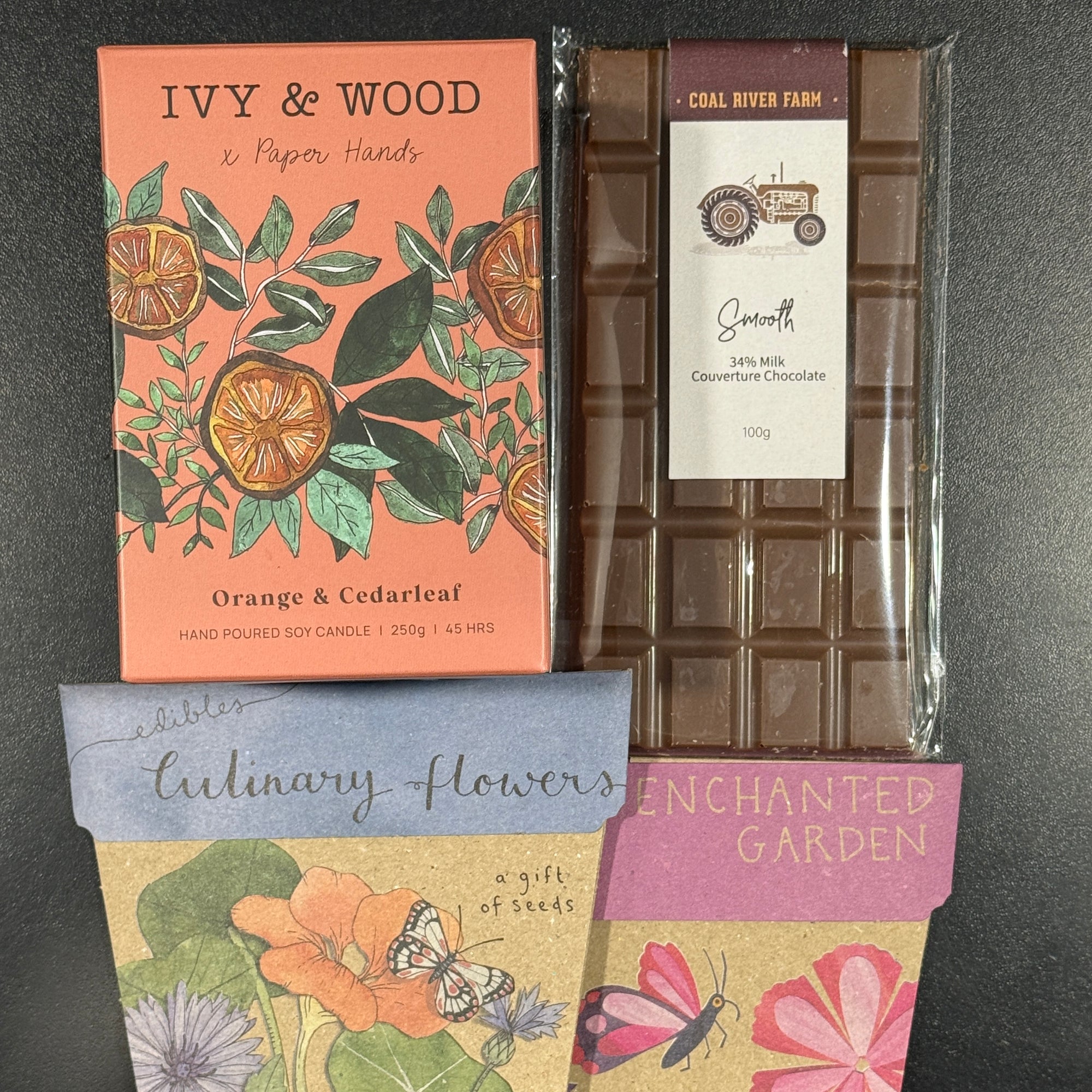 Contents of Gift Box Coal River Farm Chocolate bar, Ivy & Wood candle, Sow'n'Sow Seeds