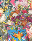 Collection of colorful La La Land greeting cards with floral and nature-themed designs.
